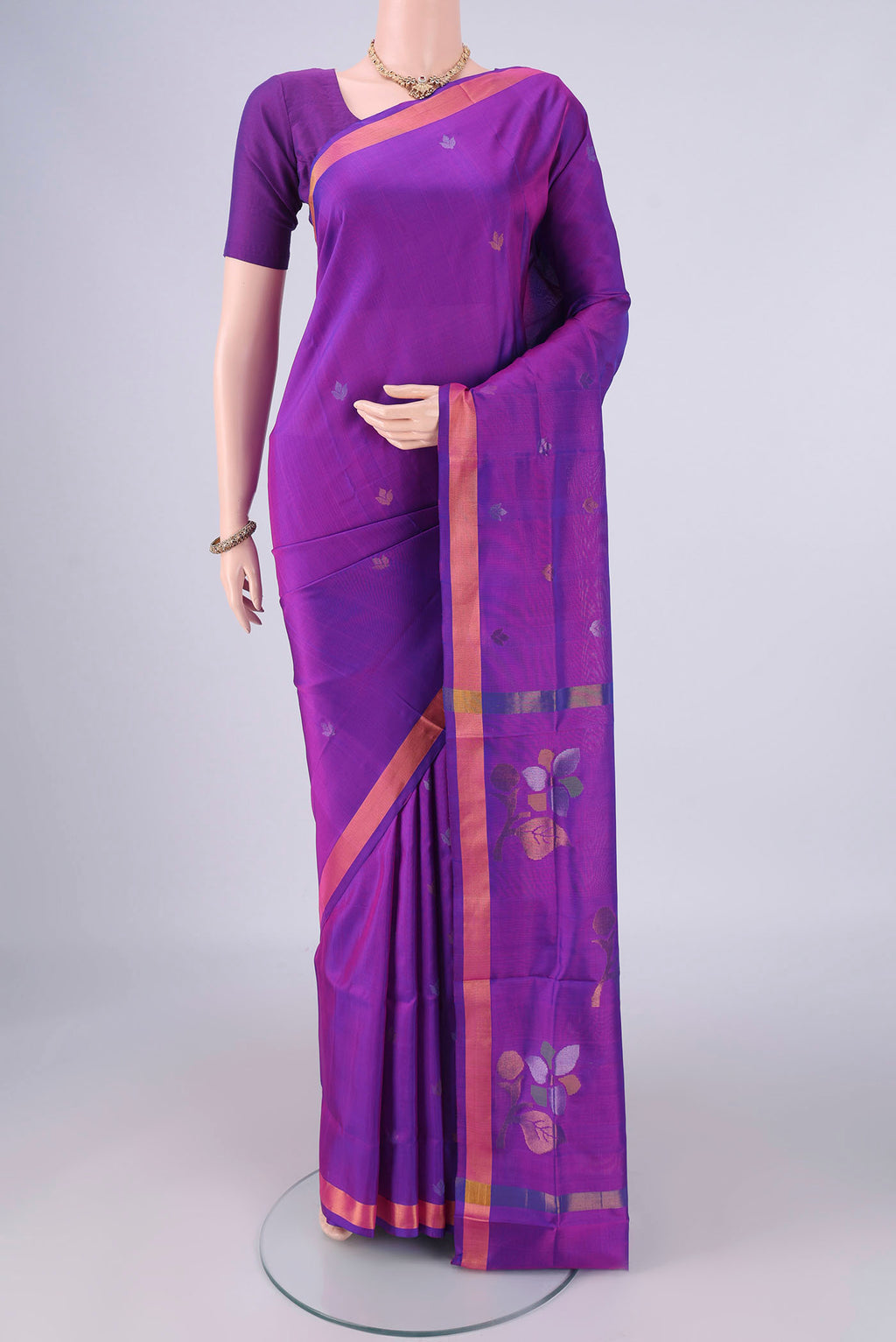 Purple Uppada Silk Saree with Zari Butta on the body and Zari Border.  displayed on a mannequin