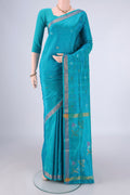 Turquoise Uppada Silk Saree with Zari Butta on the body and Zari Border.  displayed on a mannequin