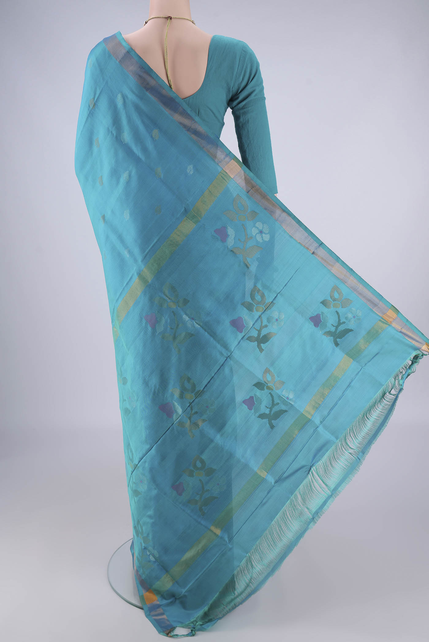 Flat view of Turquoise Uppada Silk Saree with Zari Butta on the body and Zari Border. 