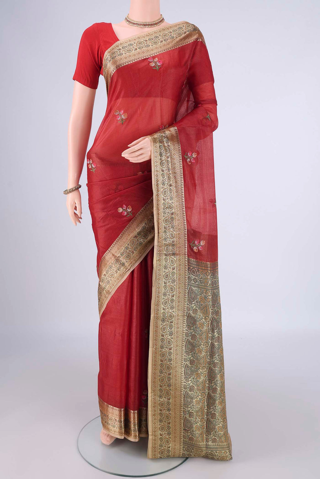 Red Banarasi Tussar Silk Saree with Embroidery on the body and Zari Border.  displayed on a mannequin