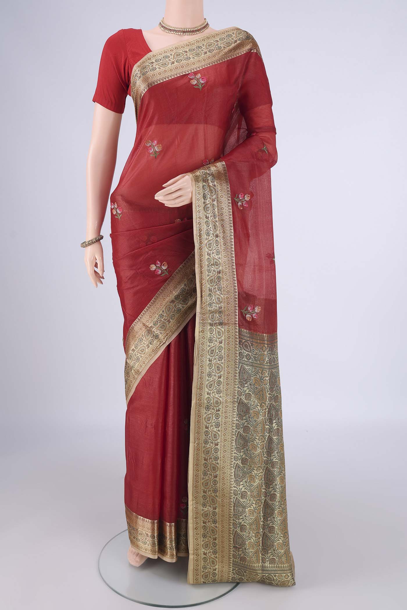 Red Banarasi Tussar Silk Saree with Embroidery on the body and Zari Border.  displayed on a mannequin