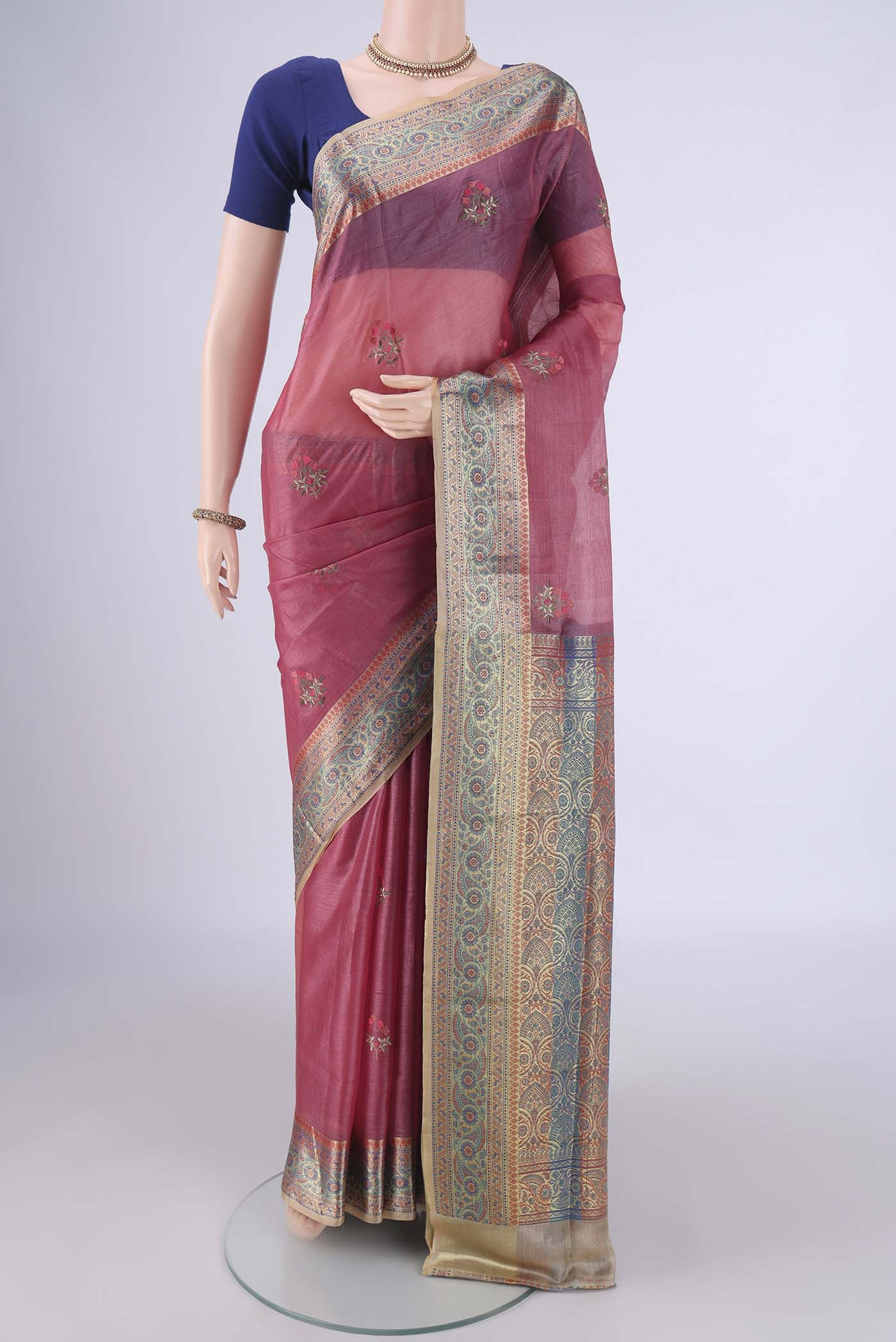 Pink Banarasi Tussar Silk Saree with Embroidery on the body and Zari Border.  displayed on a mannequin
