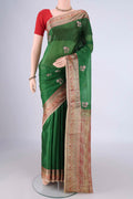 Green Banarasi Tussar Silk Saree with Embroidery on the body and Zari And Thread Border.  displayed on a mannequin