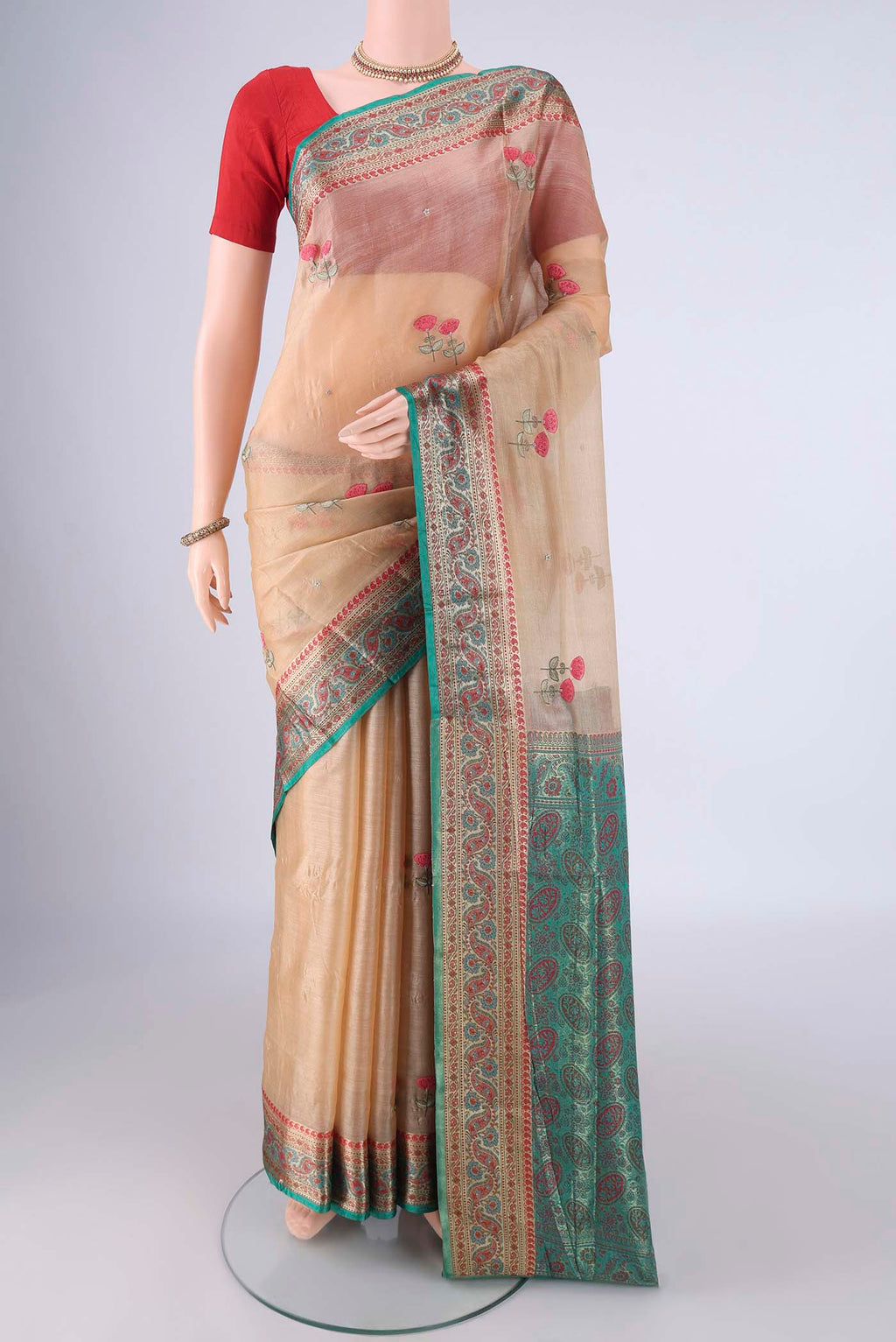 Beige Banarasi Tussar Silk Saree with Embroidery on the body and Zari Border.  displayed on a mannequin