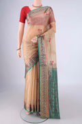 Beige Banarasi Tussar Silk Saree with Embroidery on the body and Zari Border.  displayed on a mannequin