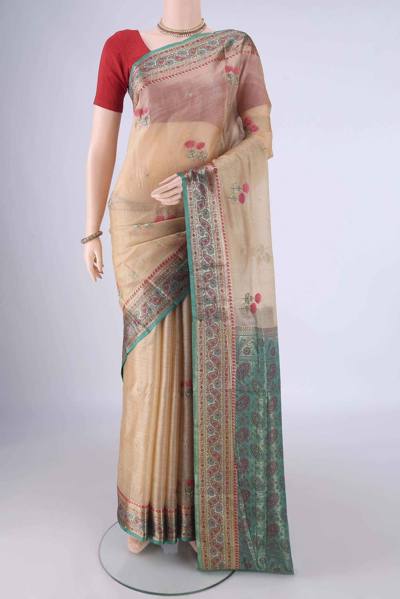Beige Banarasi Tussar Silk Saree with Embroidery on the body and Zari Border.  displayed on a mannequin