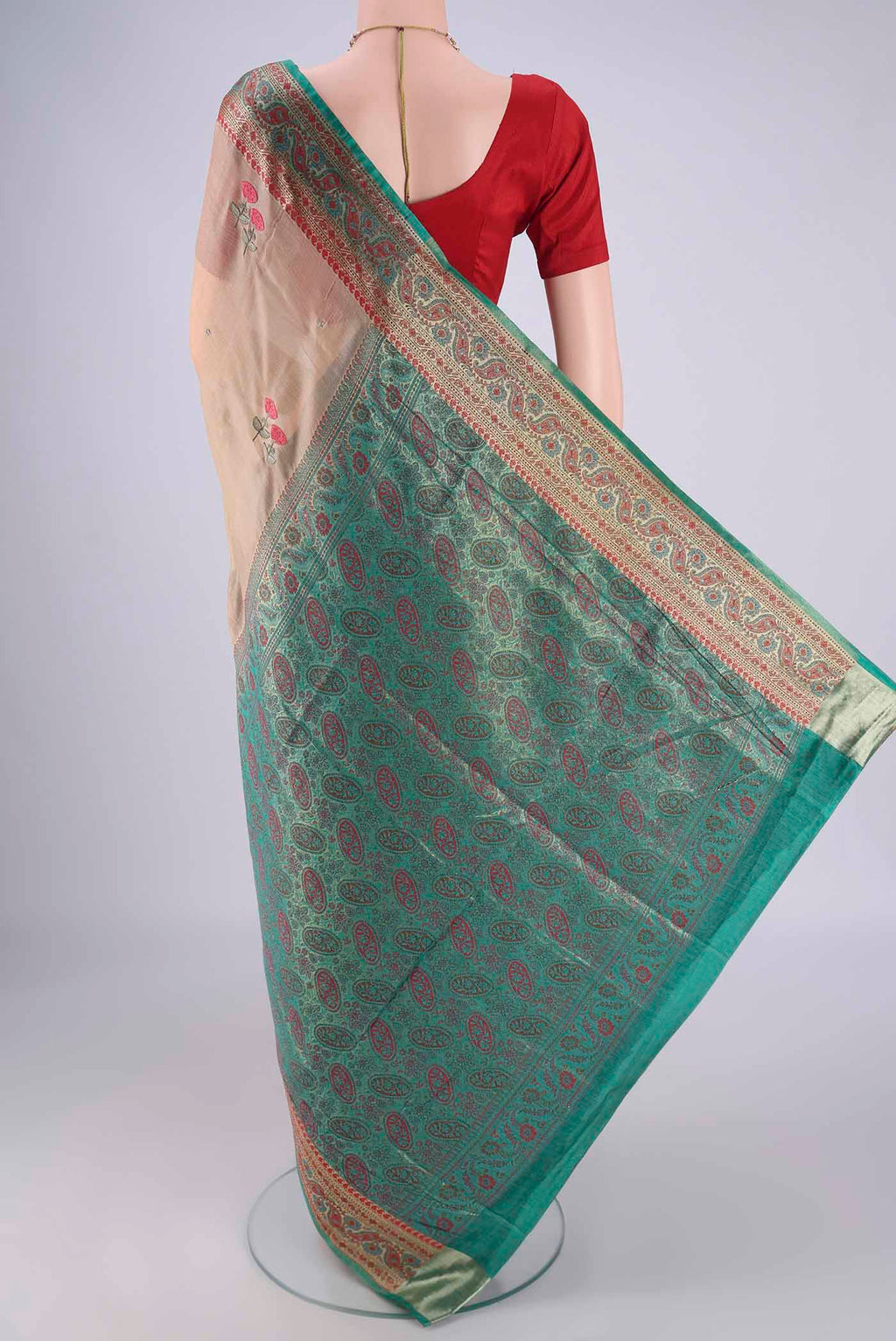 Flat view of Beige Banarasi Tussar Silk Saree with Embroidery on the body and Zari Border. 
