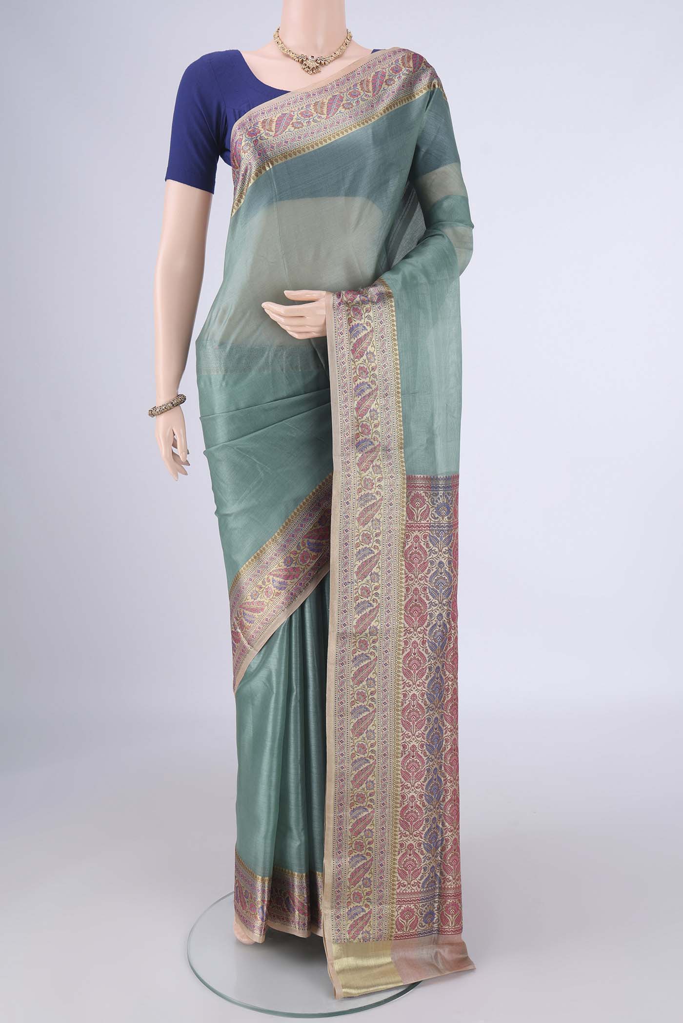 Light Blue Banarasi Tussar Silk Saree with Plain Body and Zari Border.  displayed on a mannequin