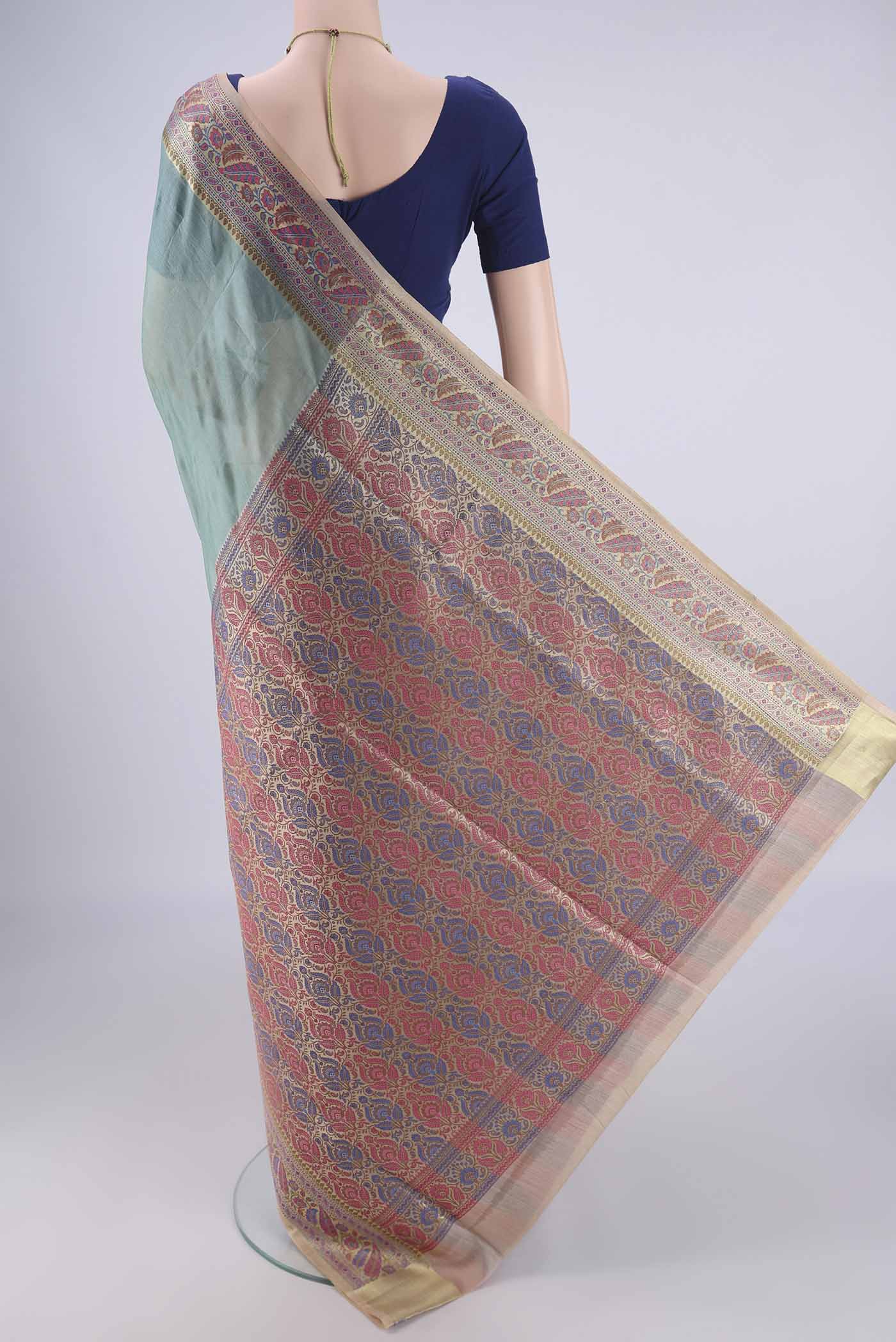 Flat view of Light Blue Banarasi Tussar Silk Saree with Plain Body and Zari Border. 