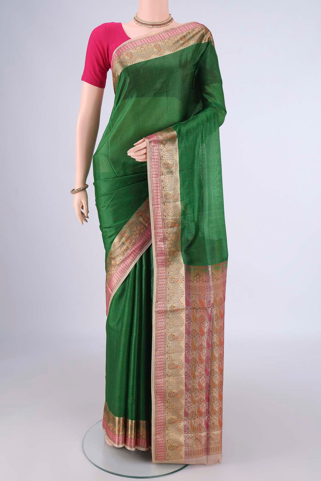 Green Banarasi Tussar Silk Saree with Plain Body and Zari Border.  displayed on a mannequin
