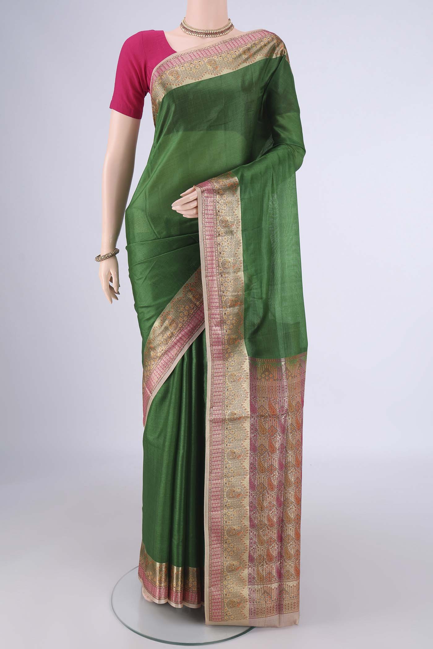 Green Banarasi Tussar Silk Saree with Plain Body and Zari Border.  displayed on a mannequin