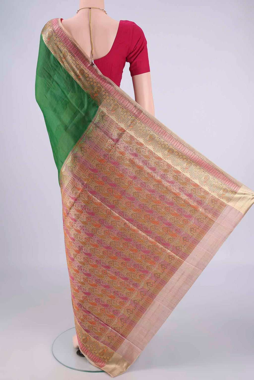 Flat view of Green Banarasi Tussar Silk Saree with Plain Body and Zari Border. 