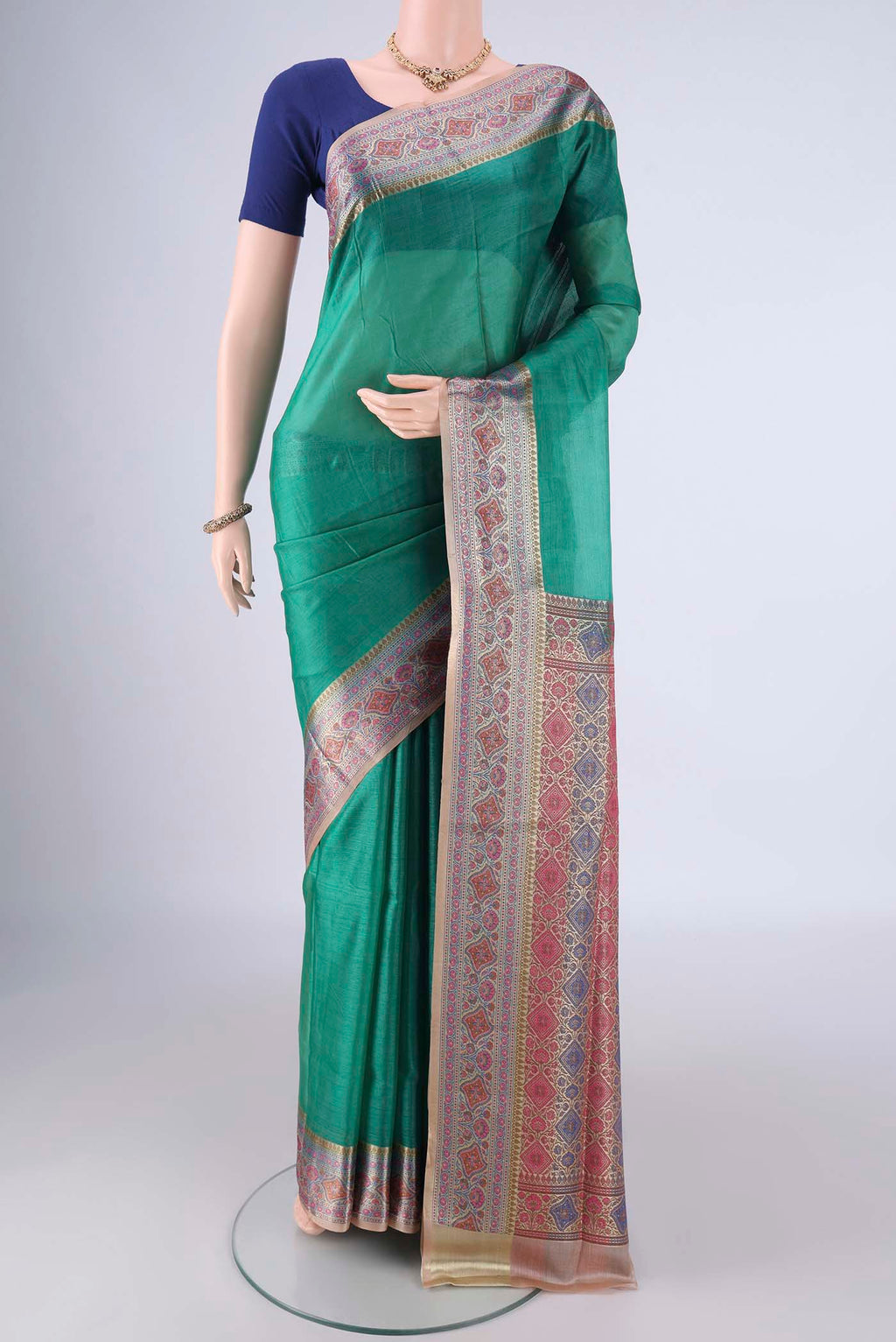 Sea Green Banarasi Tussar Silk Saree with Plain Body and Zari Border.  displayed on a mannequin