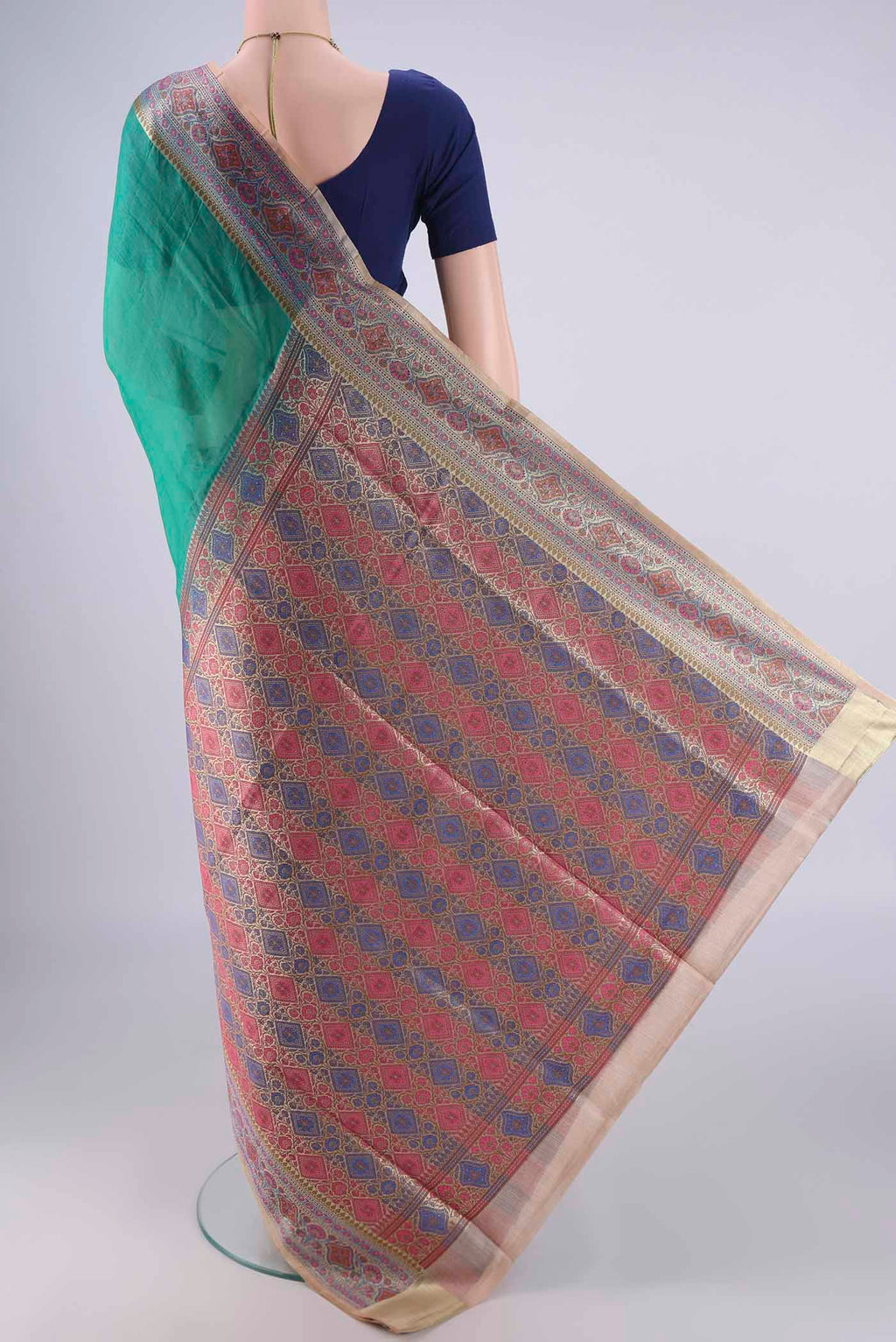 Flat view of Sea Green Banarasi Tussar Silk Saree with Plain Body and Zari Border. 