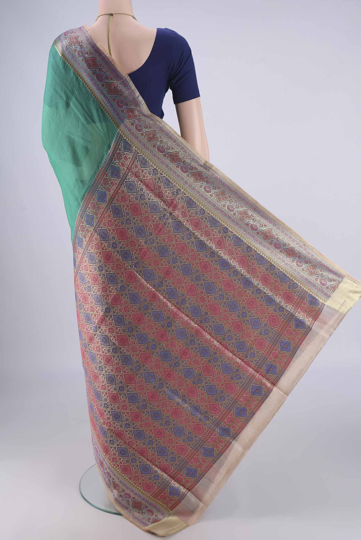 Flat view of Sea Green Banarasi Tussar Silk Saree with Plain Body and Zari Border. 