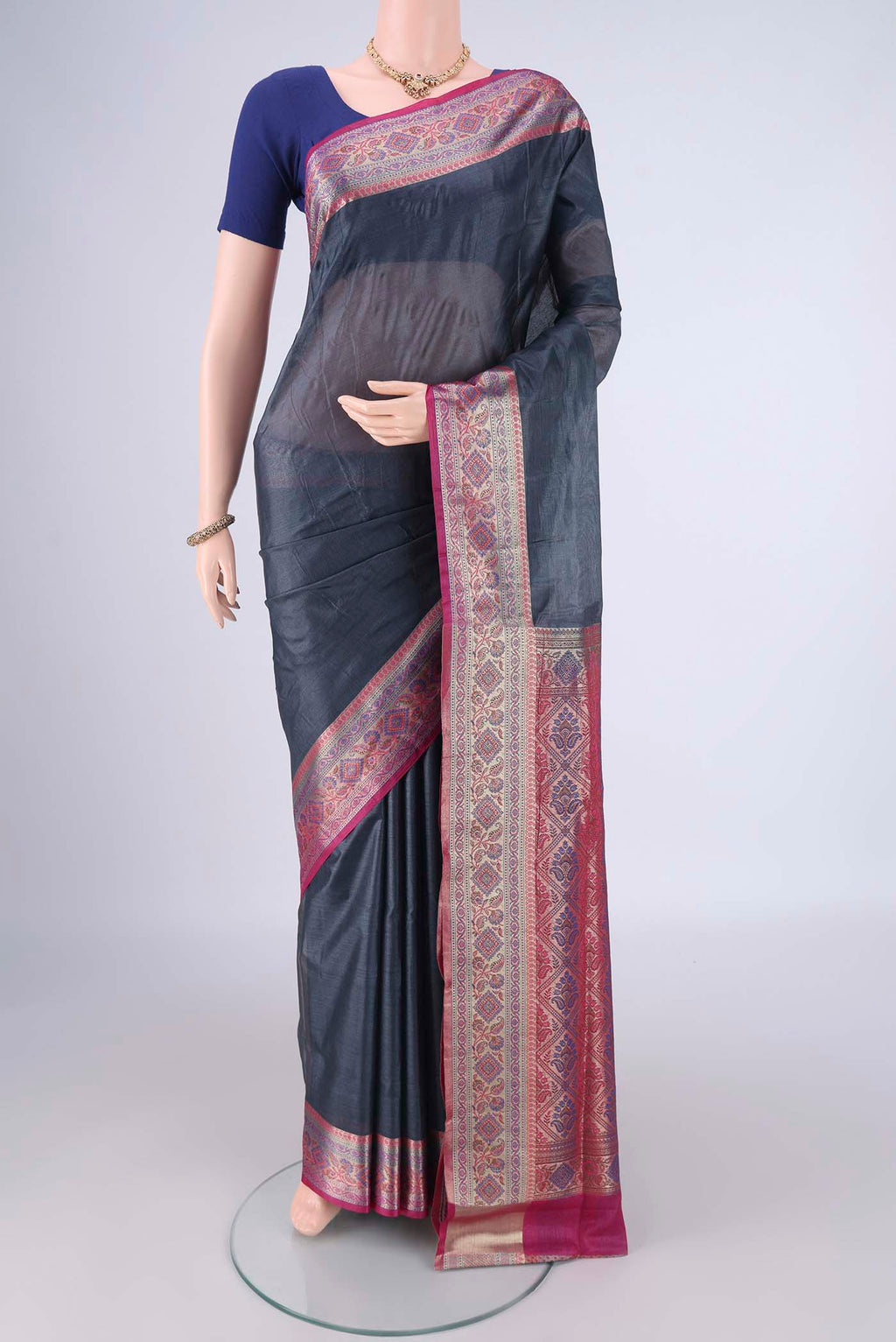 Grey Banarasi Tussar Silk Saree with Plain Body and Zari Border.  displayed on a mannequin