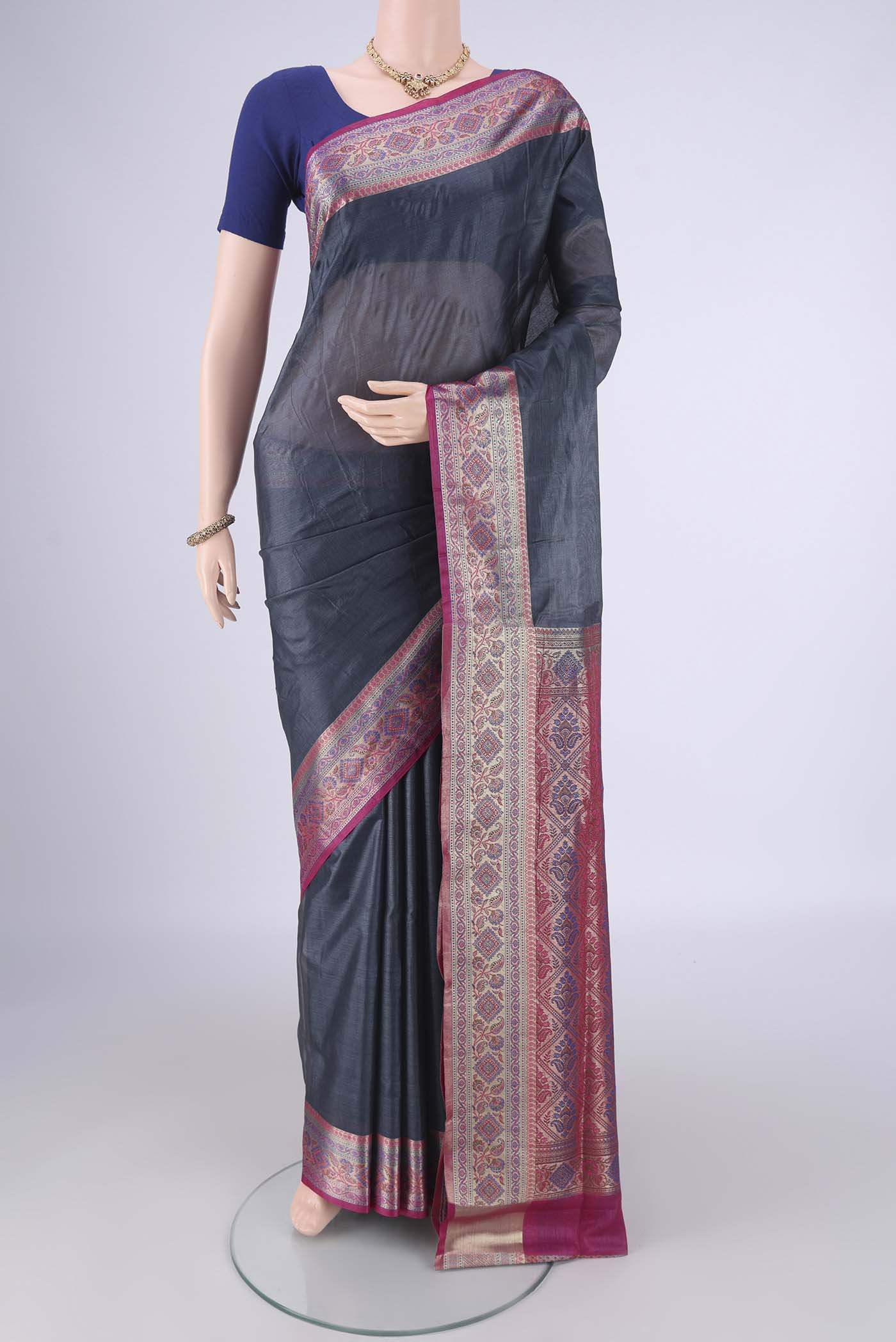 Grey Banarasi Tussar Silk Saree with Plain Body and Zari Border.  displayed on a mannequin