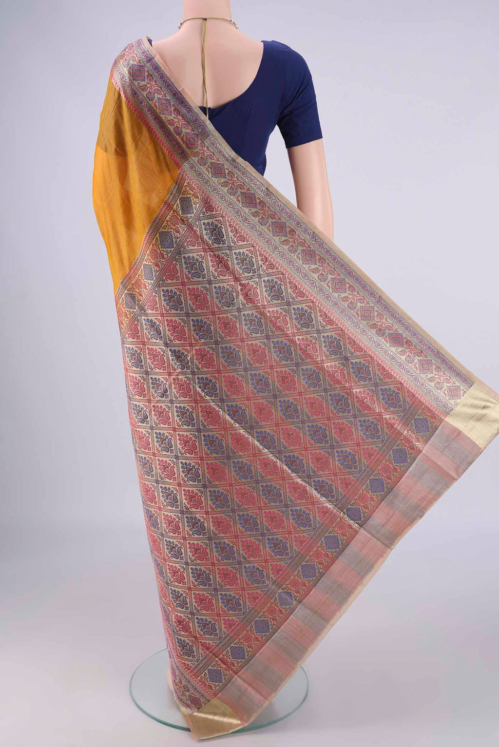 Flat view of Mustard Banarasi Tussar Silk Saree with Plain Body and Zari Border. 
