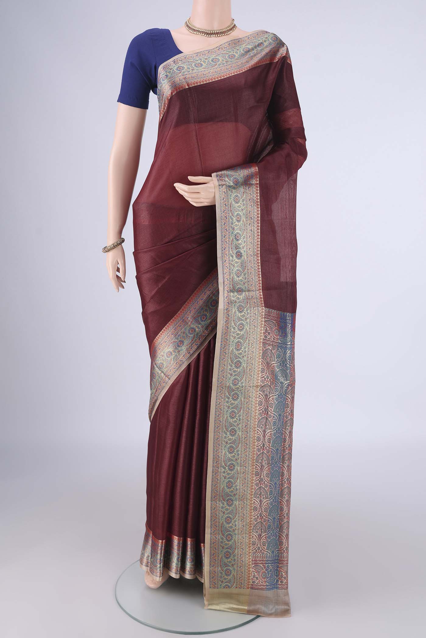 Brown Banarasi Tussar Silk Saree with Plain Body and Zari Border.  displayed on a mannequin