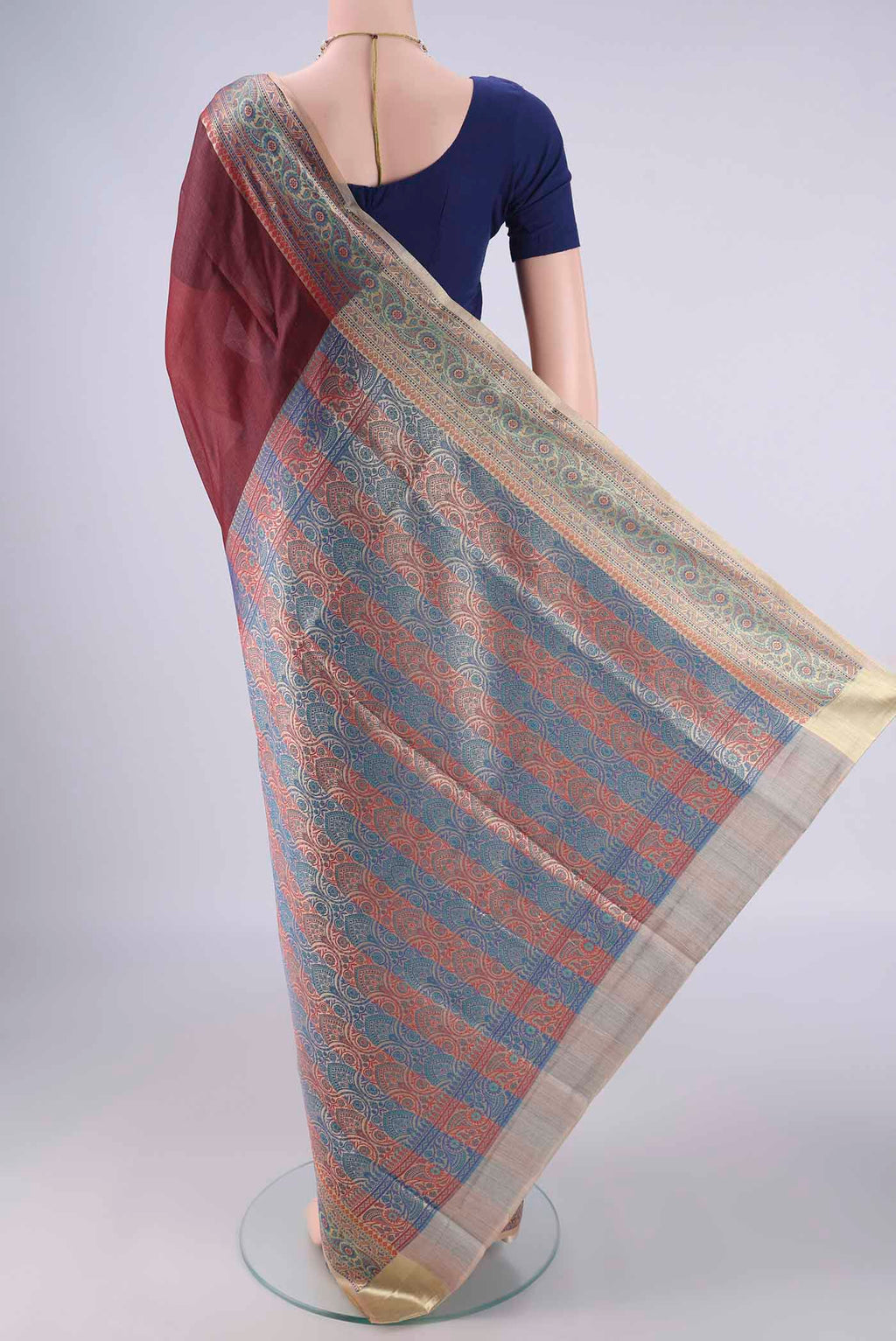 Flat view of Brown Banarasi Tussar Silk Saree with Plain Body and Zari Border. 