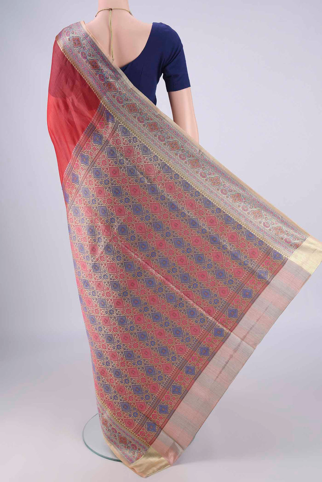 Flat view of Rust Banarasi Tussar Silk Saree with Plain Body and Zari Border. 