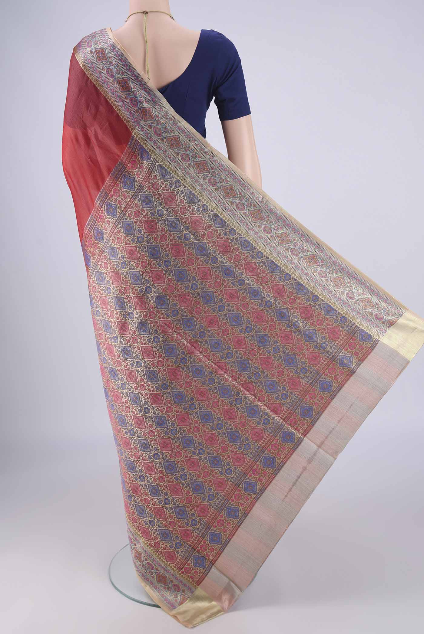 Flat view of Rust Banarasi Tussar Silk Saree with Plain Body and Zari Border. 