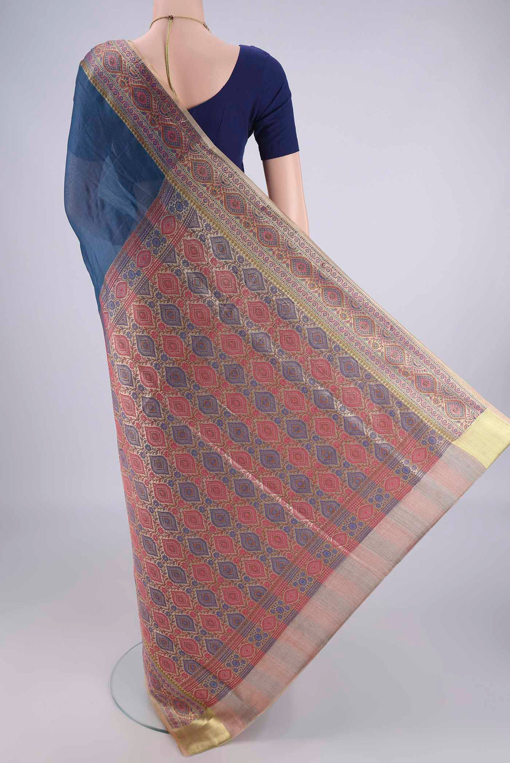 Flat view of Blue Banarasi Tussar Silk Saree with Plain Body and Zari Border. 