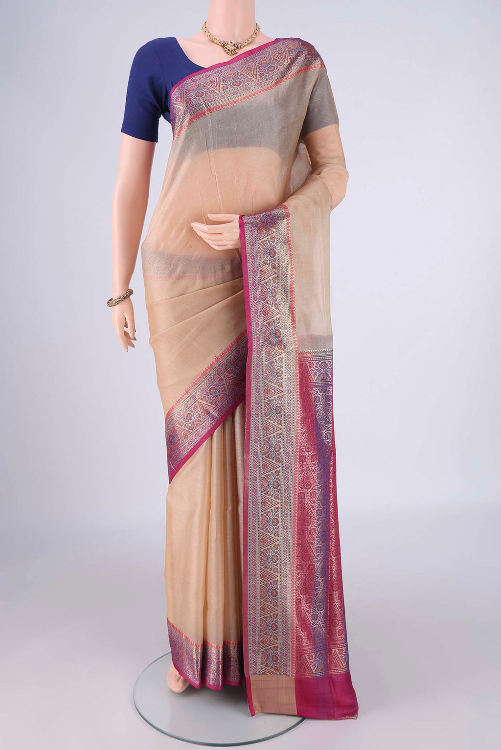 Beige Banarasi Tussar Silk Saree with Plain Body and Zari Border.  displayed on a mannequin