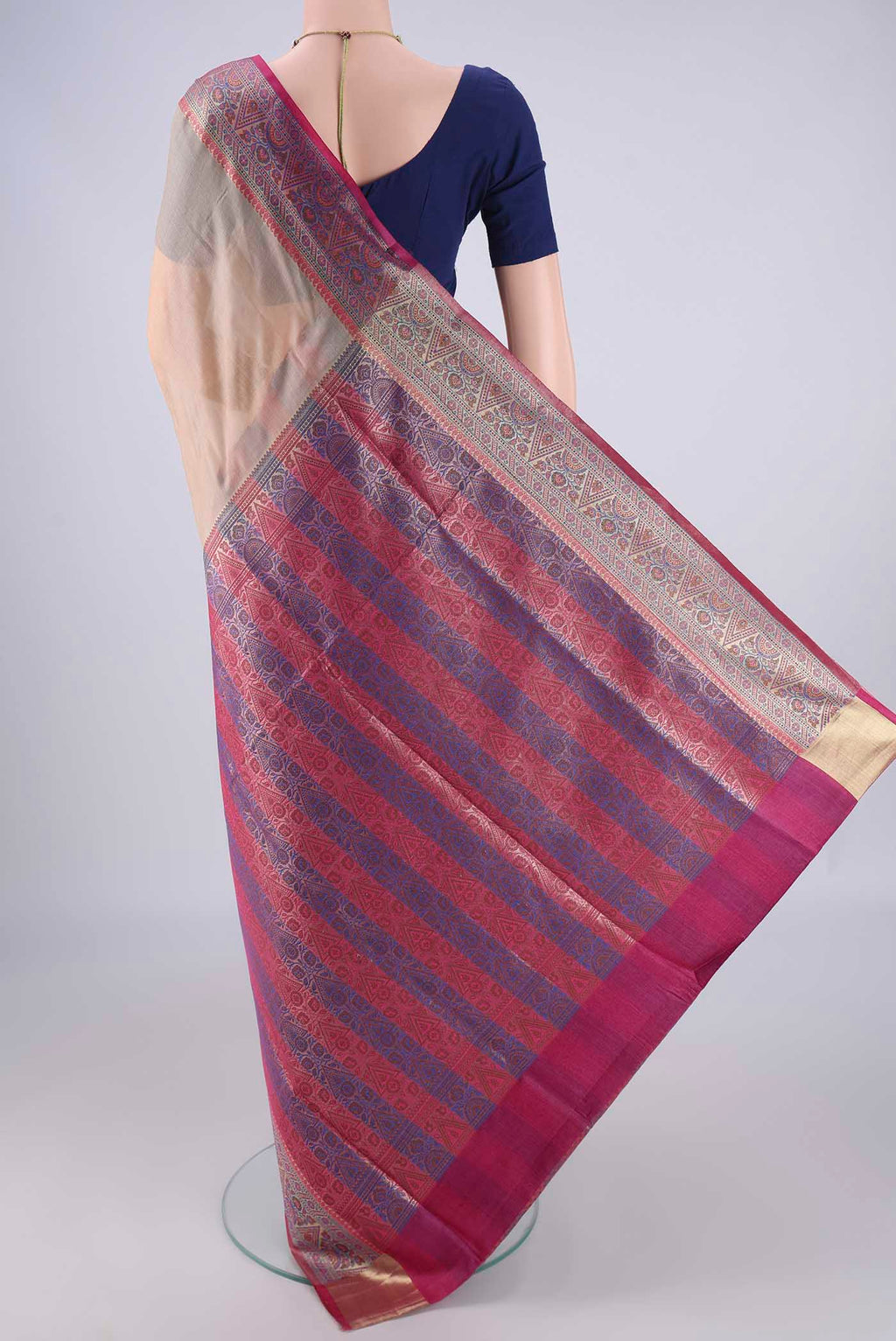 Flat view of Beige Banarasi Tussar Silk Saree with Plain Body and Zari Border. 