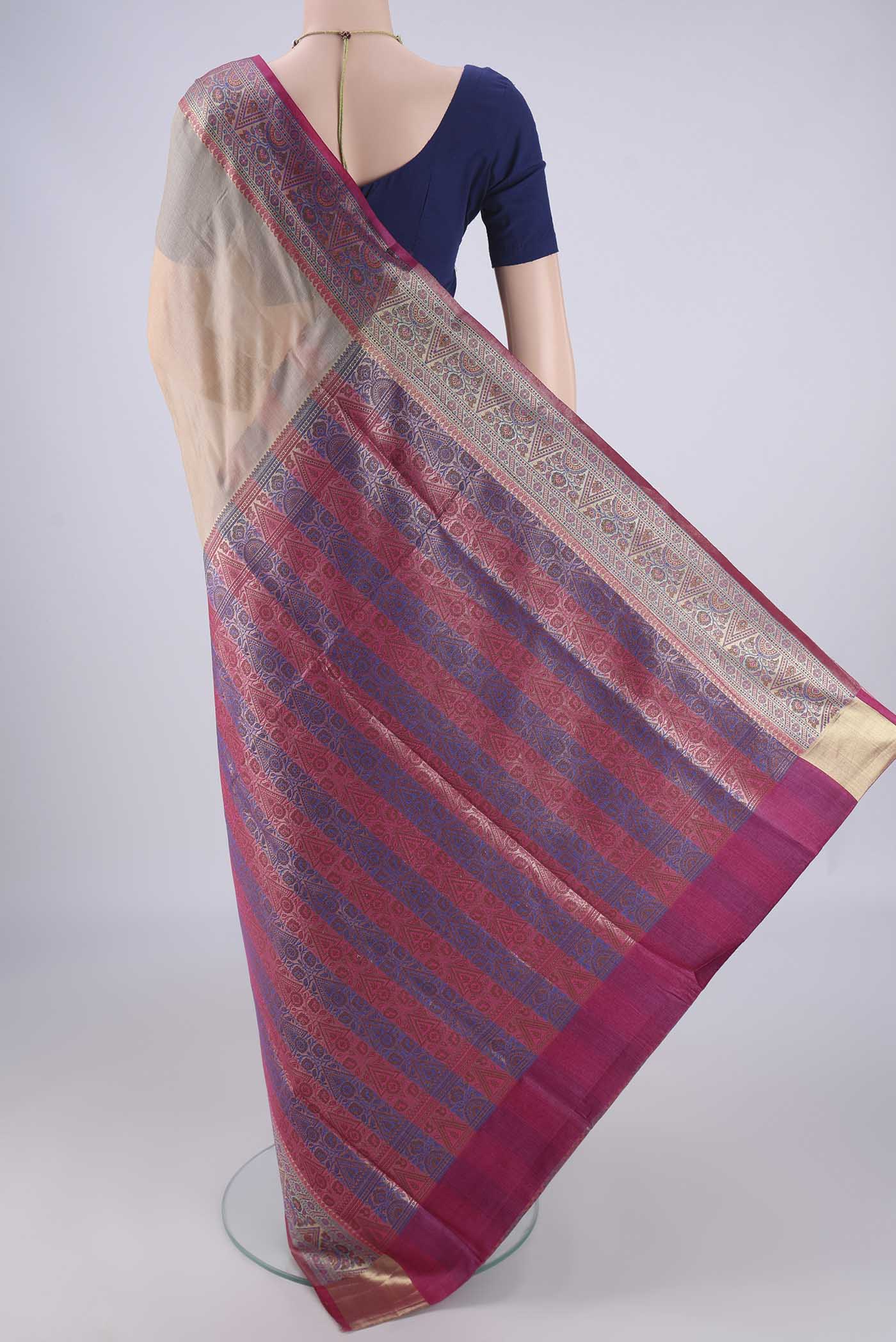 Flat view of Beige Banarasi Tussar Silk Saree with Plain Body and Zari Border. 