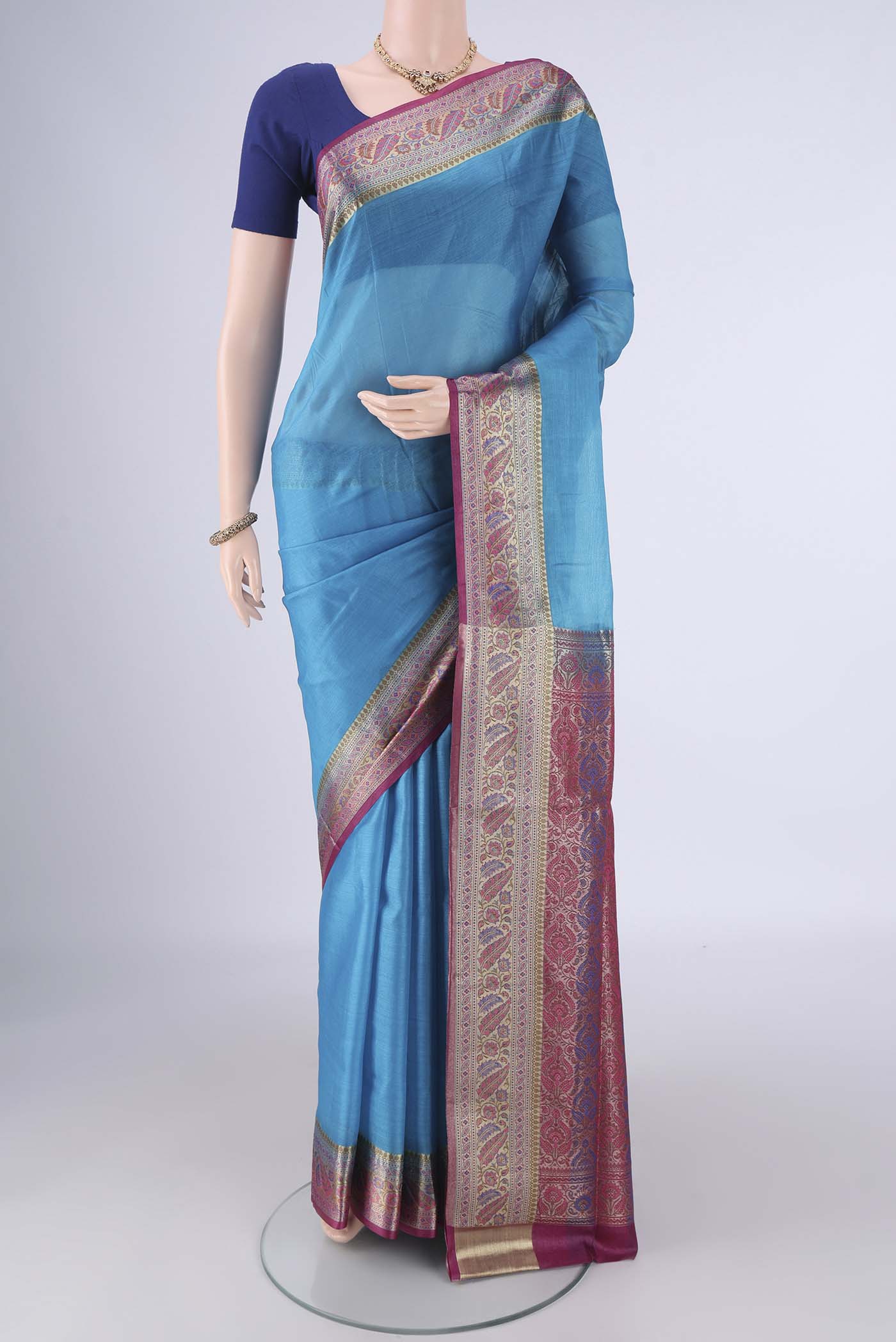 Blue Banarasi Tussar Silk Saree with Plain Body and Zari Border.  displayed on a mannequin