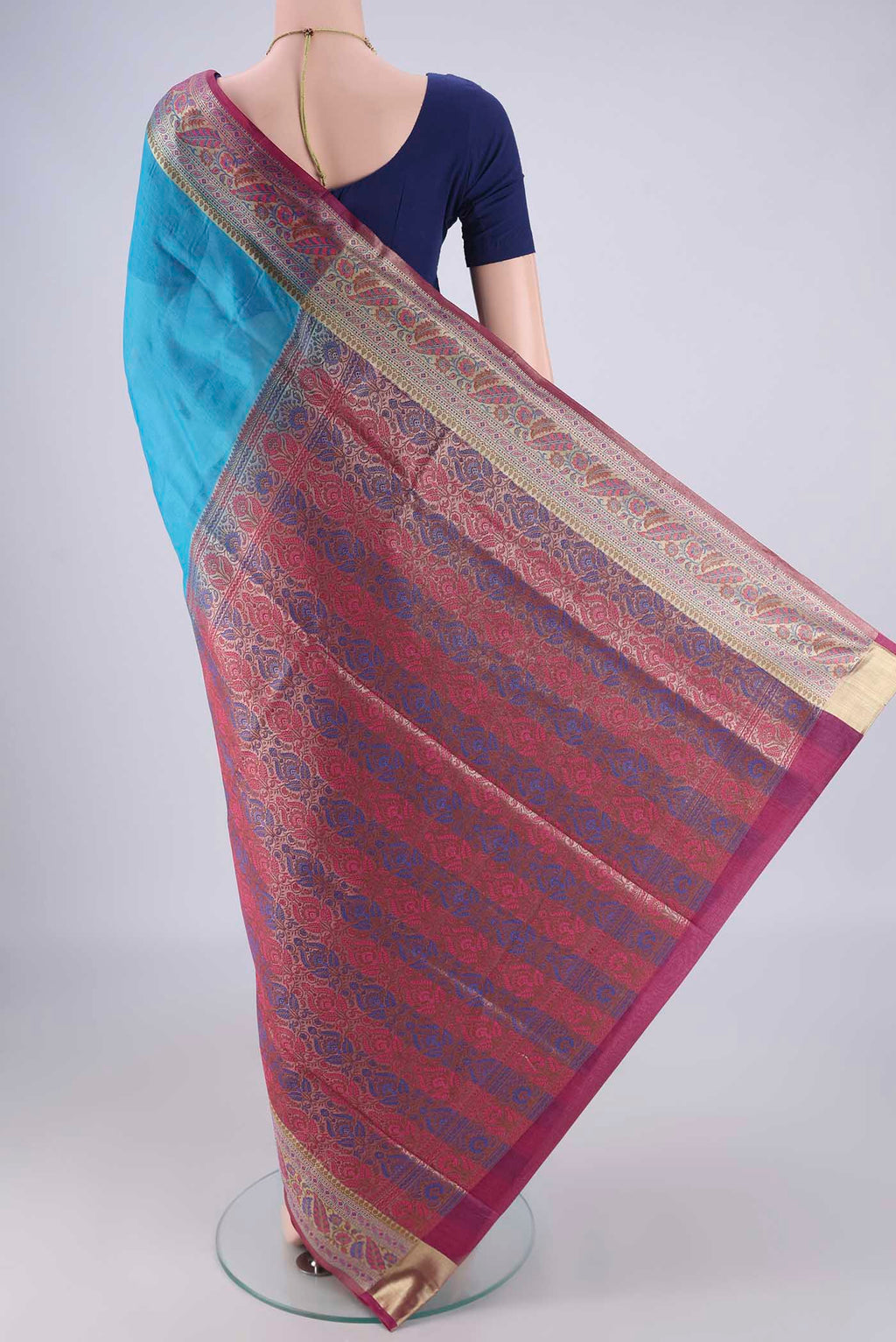 Flat view of Blue Banarasi Tussar Silk Saree with Plain Body and Zari Border. 