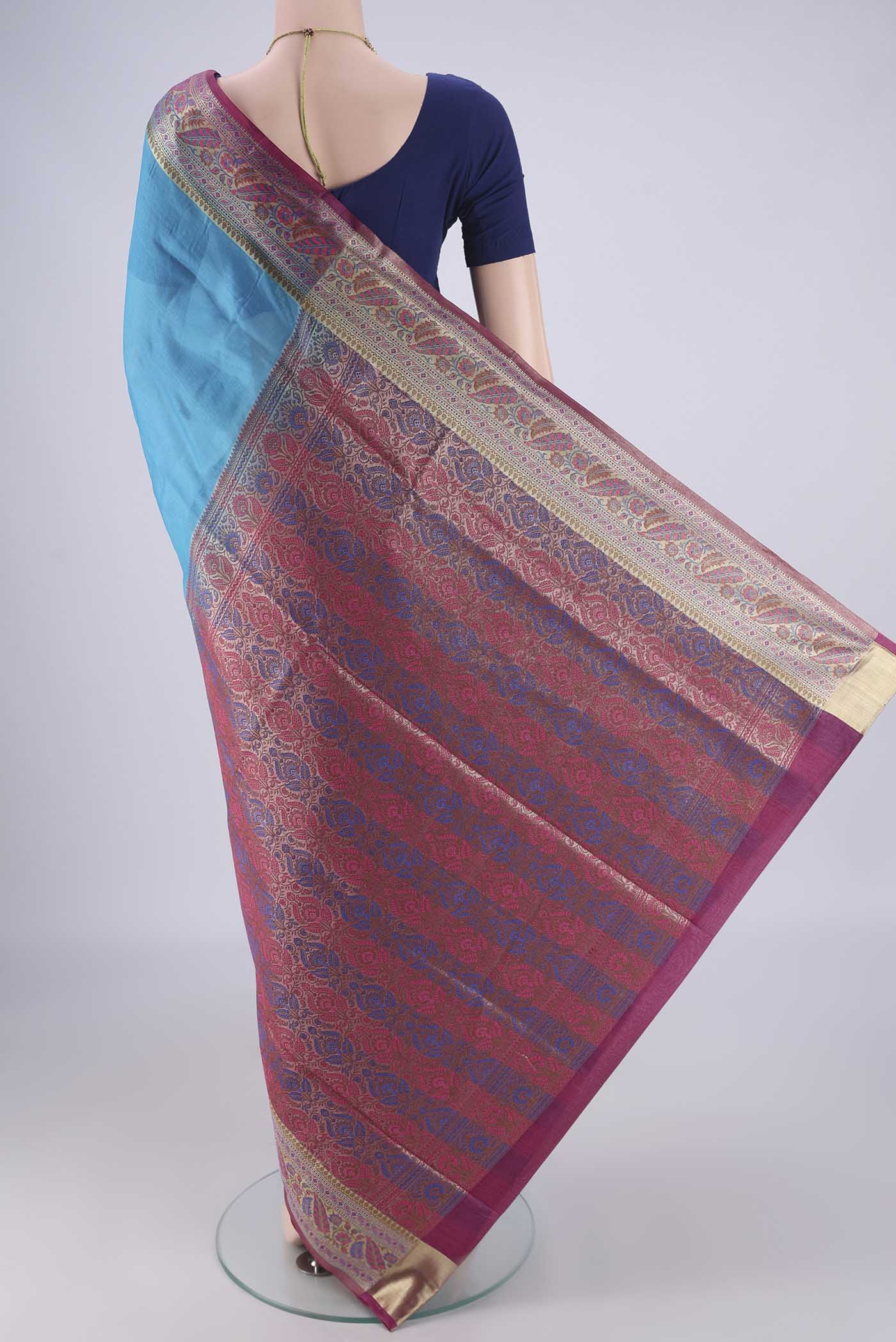 Flat view of Blue Banarasi Tussar Silk Saree with Plain Body and Zari Border. 