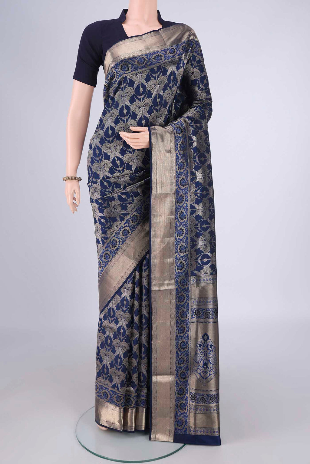 Navy Blue Soft Silk Saree with Zari Brocade on the body and Zari Border.  displayed on a mannequin