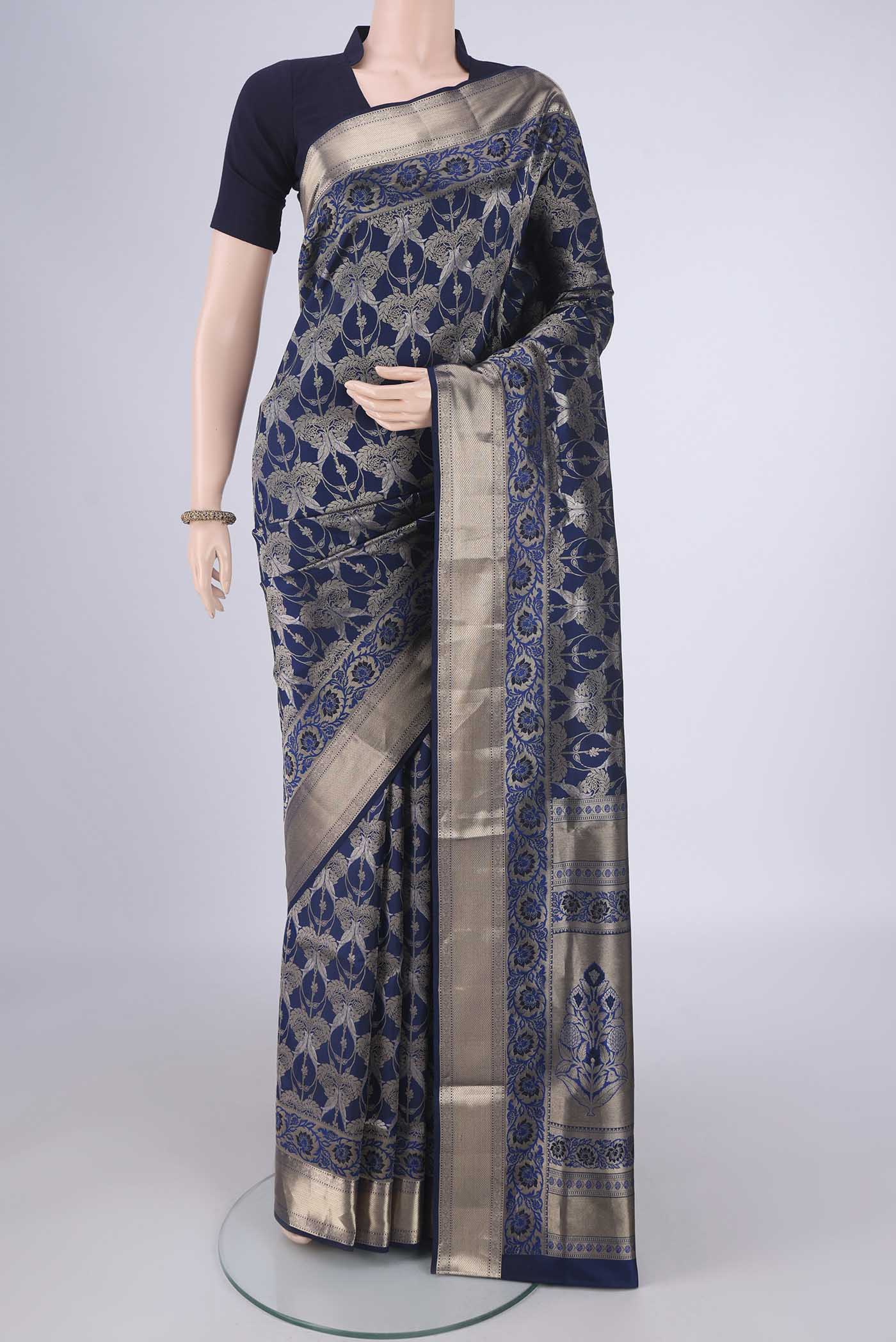 Navy Blue Soft Silk Saree with Zari Brocade on the body and Zari Border.  displayed on a mannequin