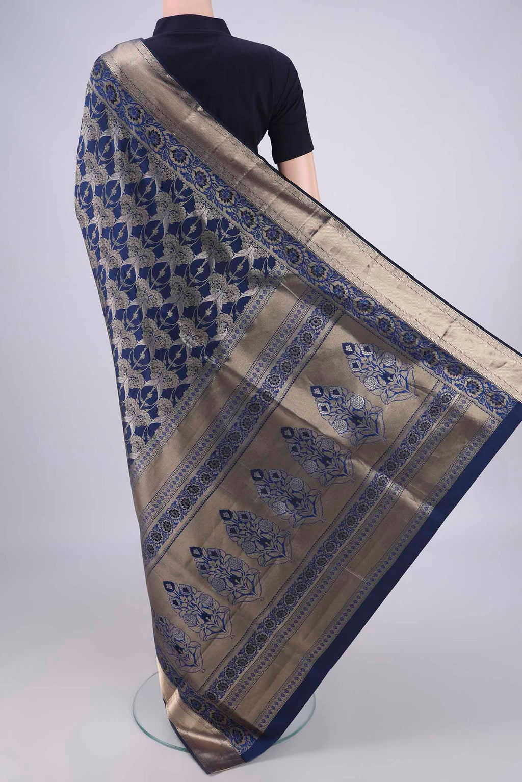 Flat view of Navy Blue Soft Silk Saree with Zari Brocade on the body and Zari Border. 