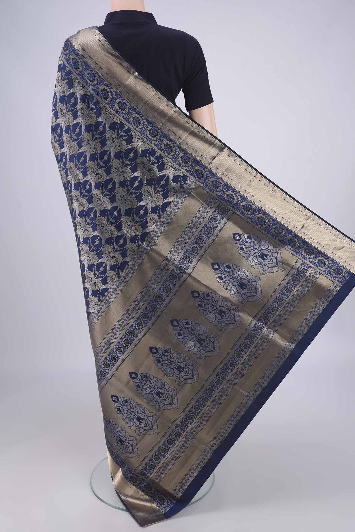 Flat view of Navy Blue Soft Silk Saree with Zari Brocade on the body and Zari Border. 