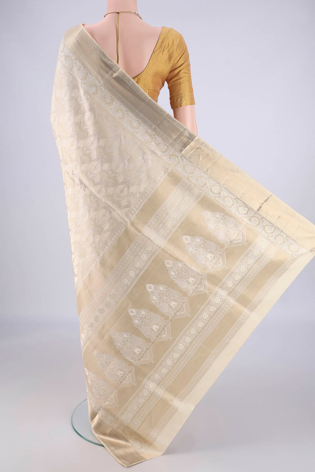 Flat view of Off White Soft Silk Saree with Zari Brocade on the body and Zari Border. 