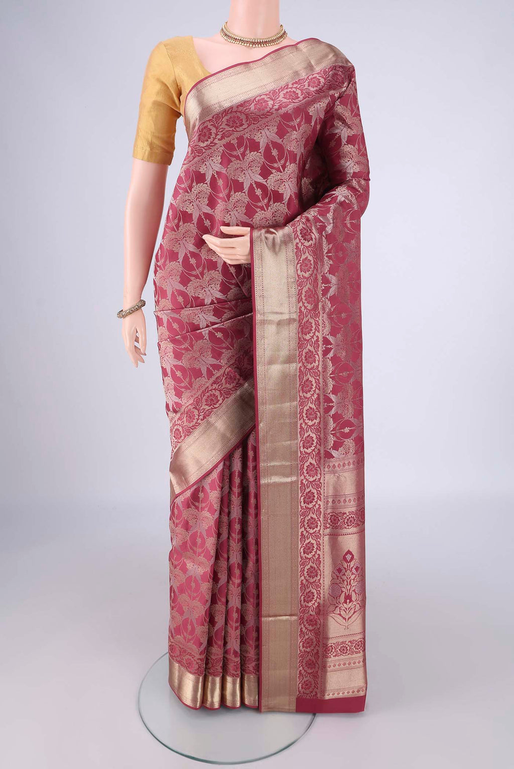 Pink Soft Silk Saree with Zari Brocade on the body and Zari Border.  displayed on a mannequin