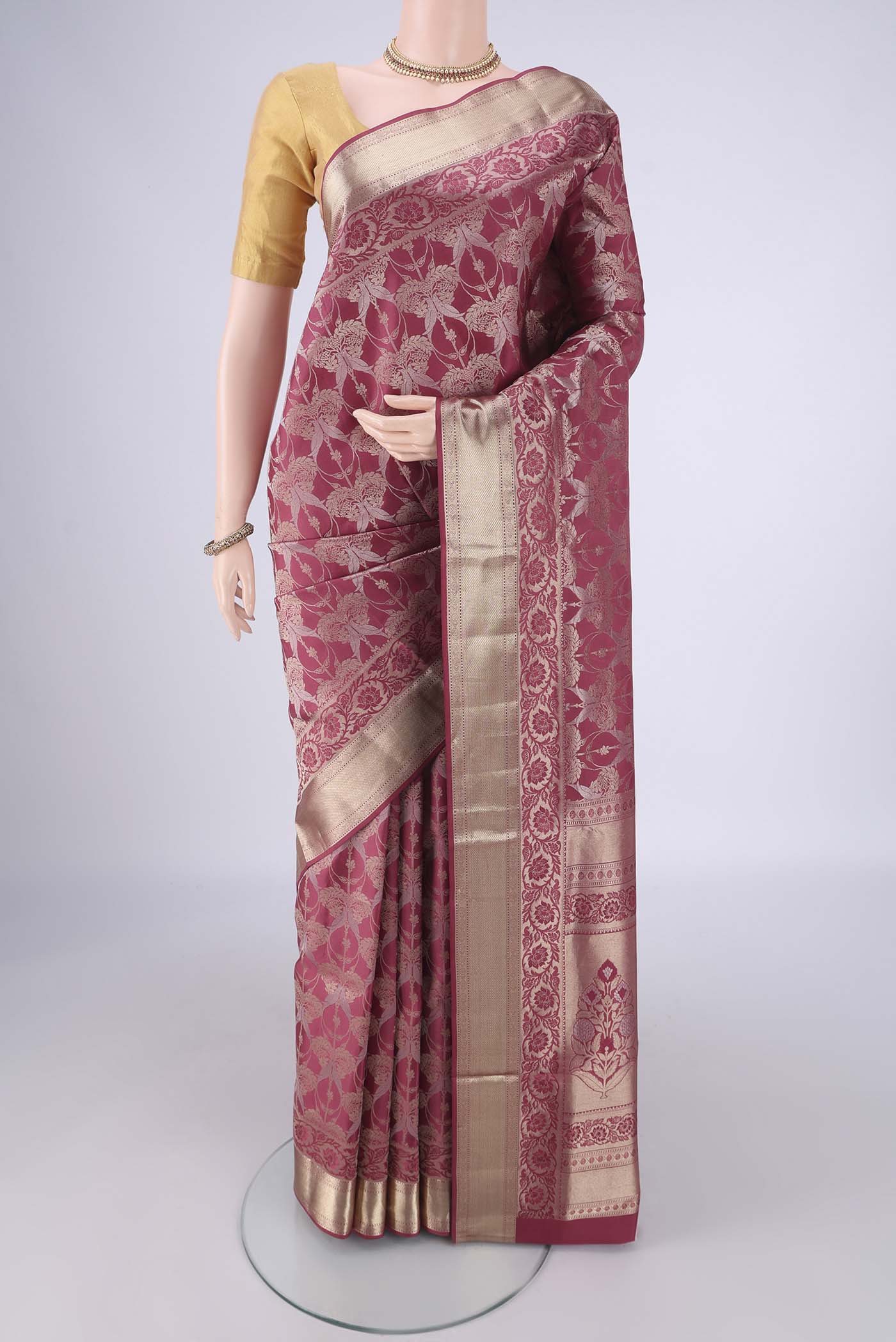 Pink Soft Silk Saree with Zari Brocade on the body and Zari Border.  displayed on a mannequin