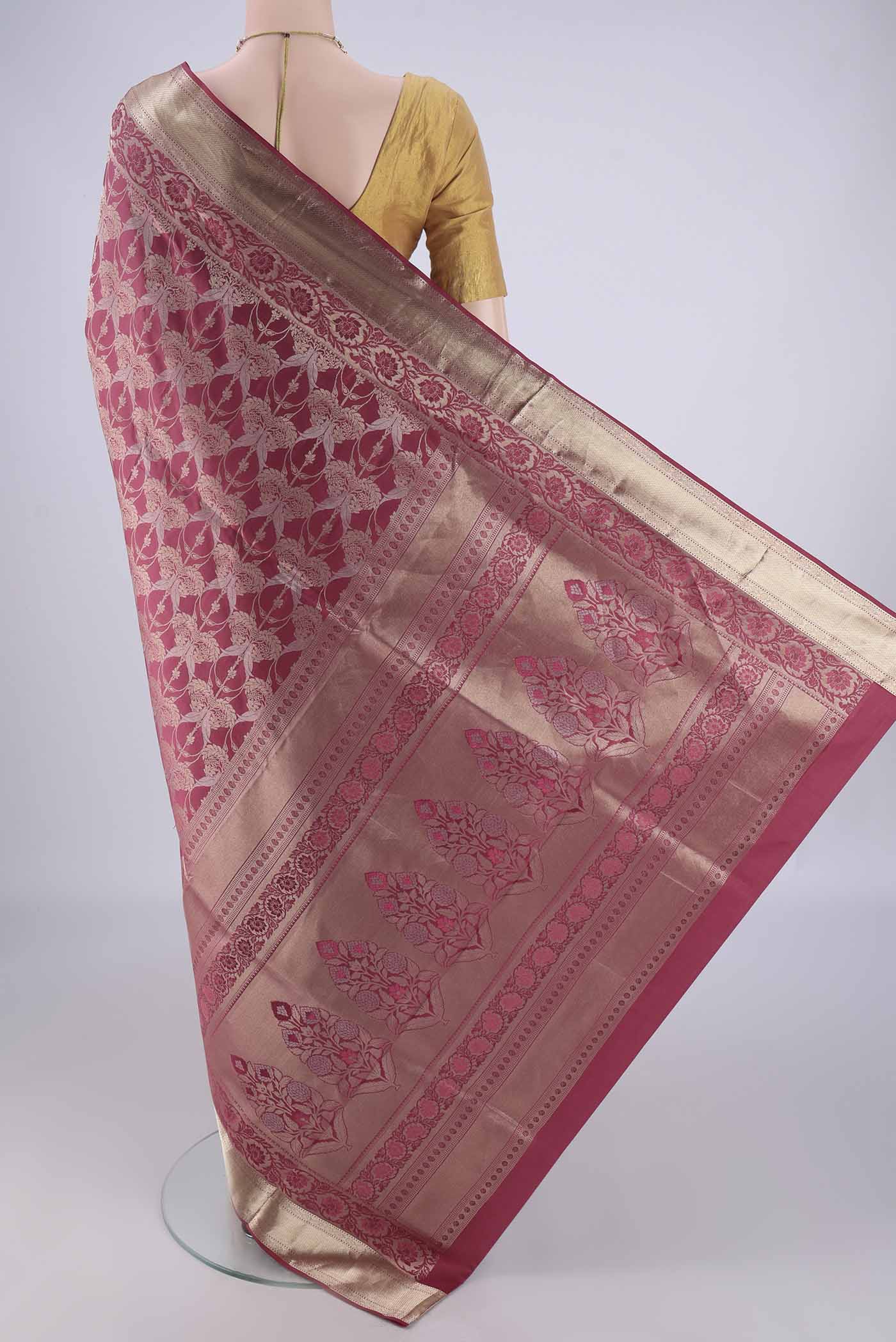 Flat view of Pink Soft Silk Saree with Zari Brocade on the body and Zari Border. 