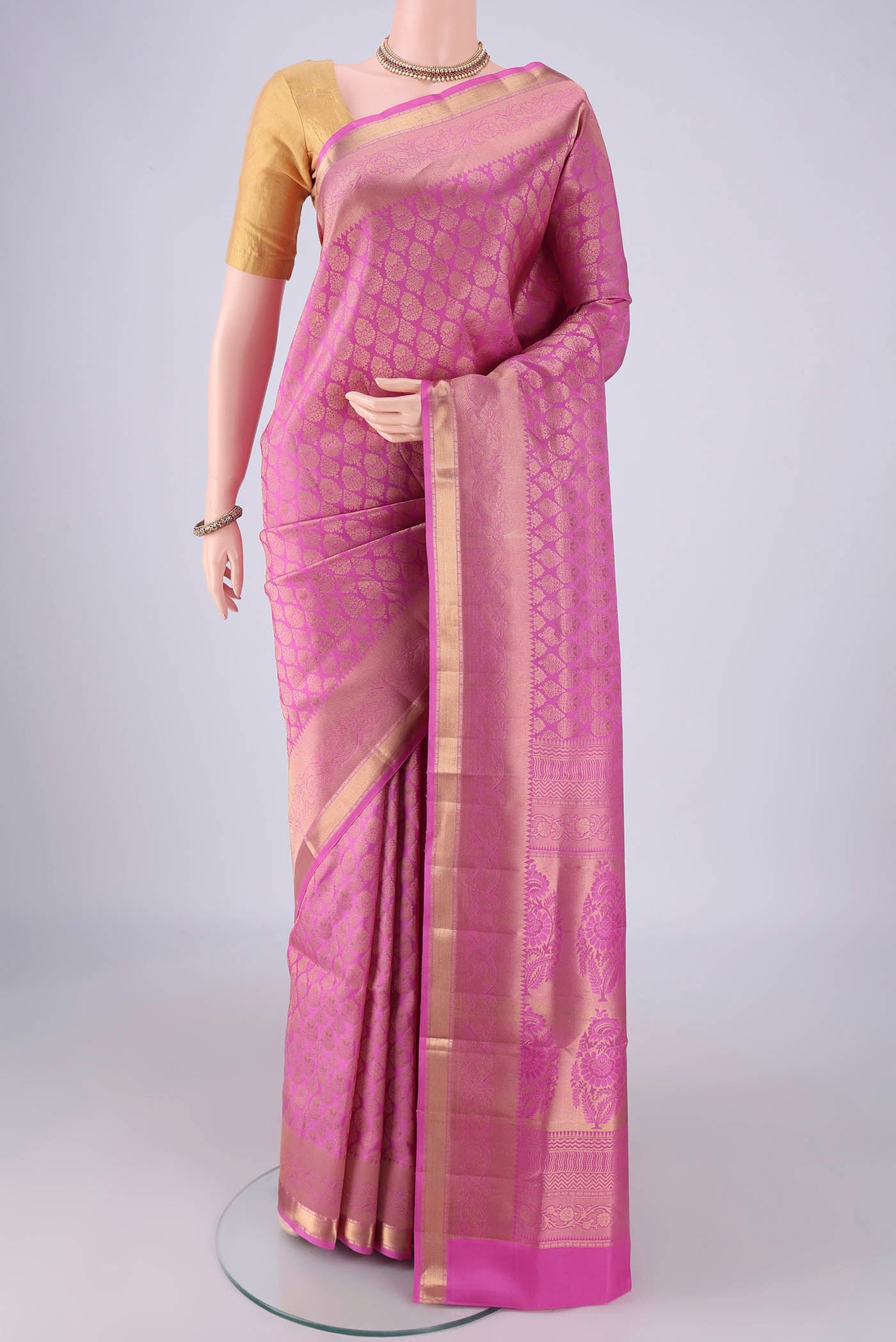 Rose pink Soft Silk Saree with Zari Brocade on the body and Zari Border.  displayed on a mannequin