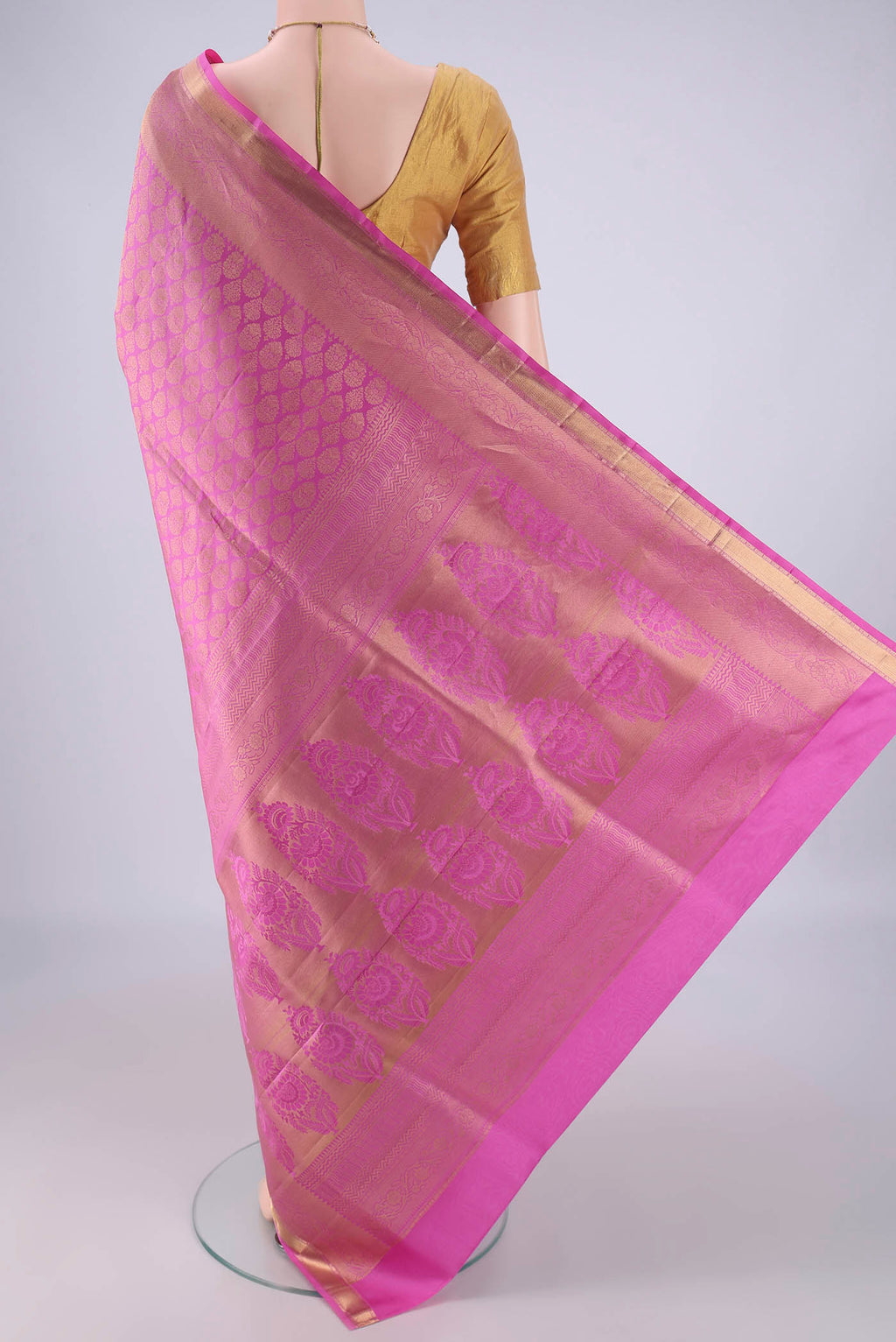 Flat view of Rose pink Soft Silk Saree with Zari Brocade on the body and Zari Border. 