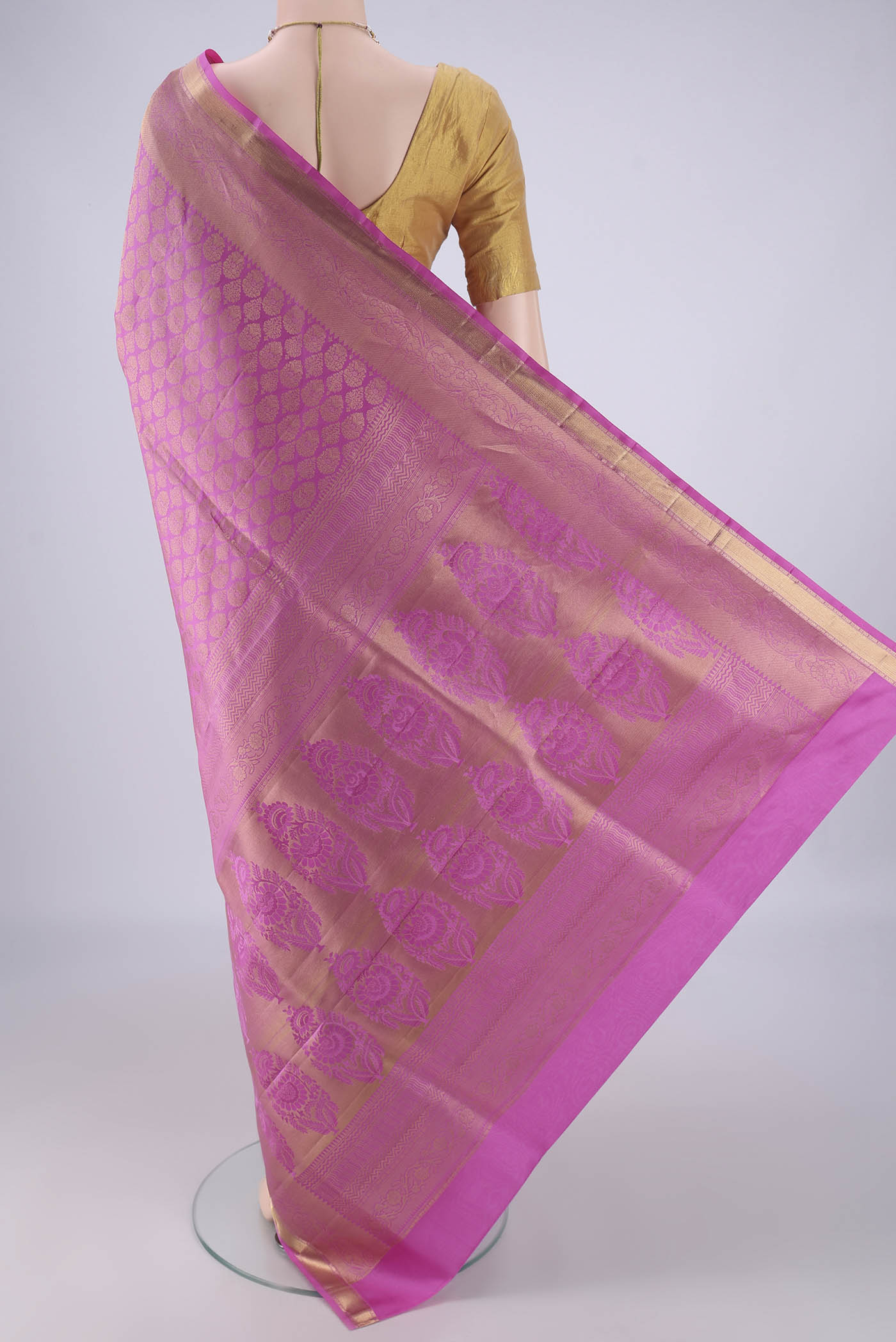 Flat view of Rose pink Soft Silk Saree with Zari Brocade on the body and Zari Border. 