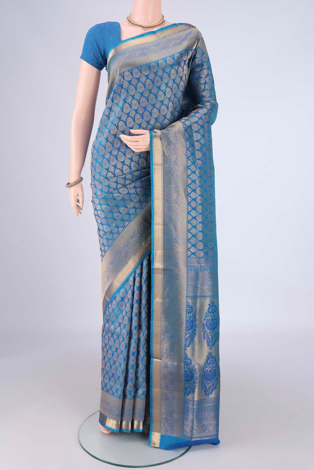 Blue Soft Silk Saree with Zari Brocade on the body and Zari Border.  displayed on a mannequin