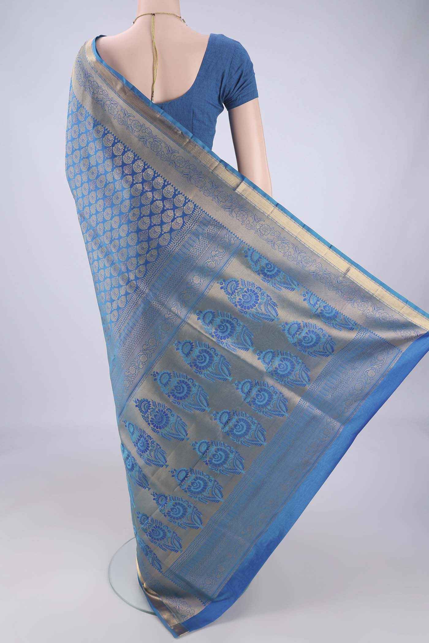 Flat view of Blue Soft Silk Saree with Zari Brocade on the body and Zari Border. 