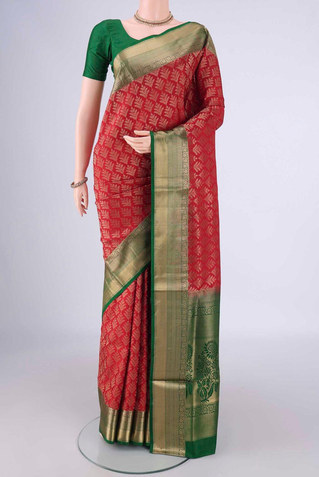 Red Soft Silk Saree with Zari Brocade on the body and Zari Border.  displayed on a mannequin