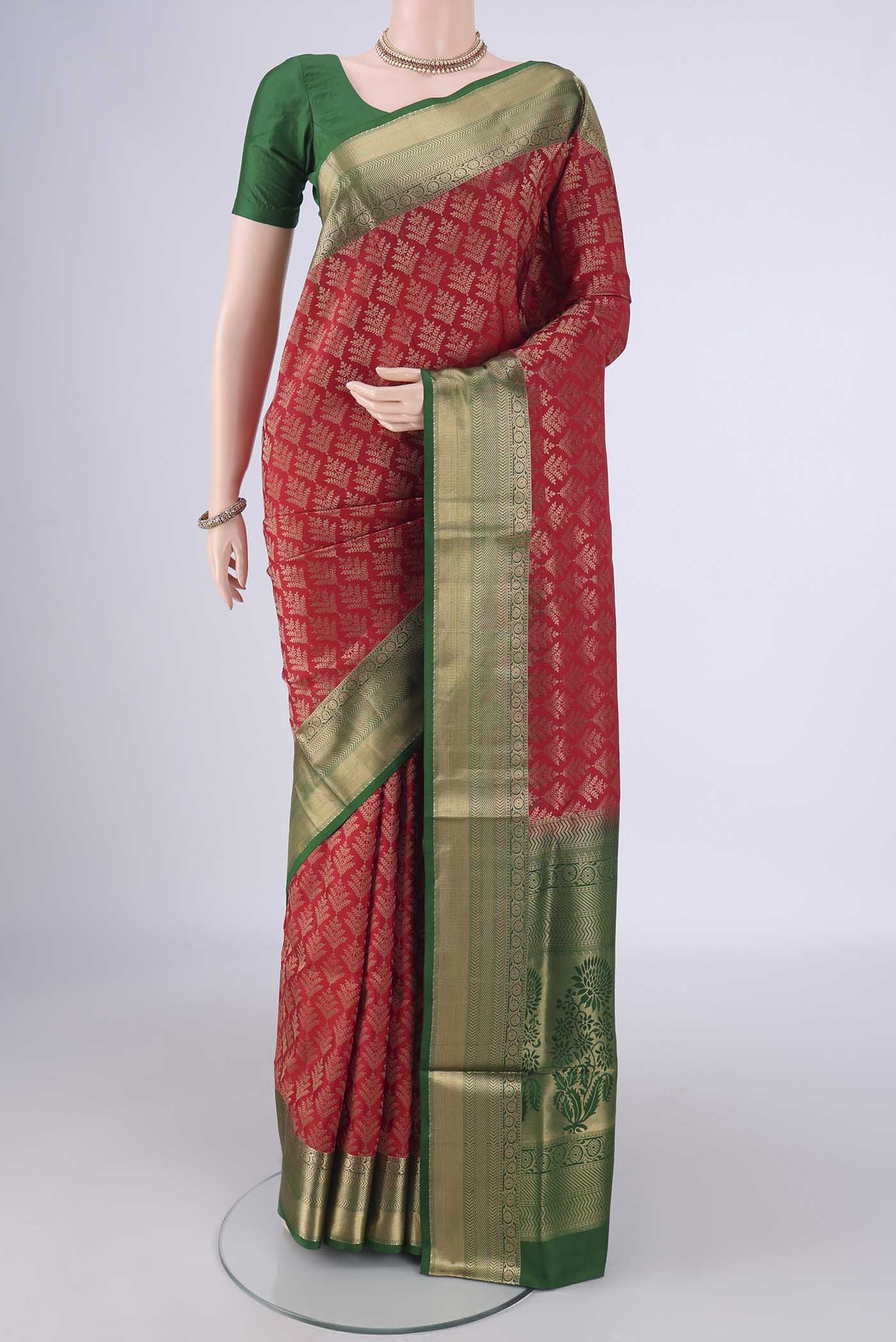 Red Soft Silk Saree with Zari Brocade on the body and Zari Border.  displayed on a mannequin