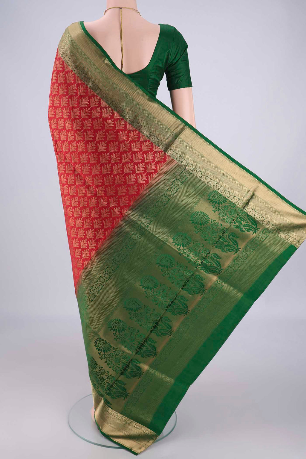 Flat view of Red Soft Silk Saree with Zari Brocade on the body and Zari Border. 