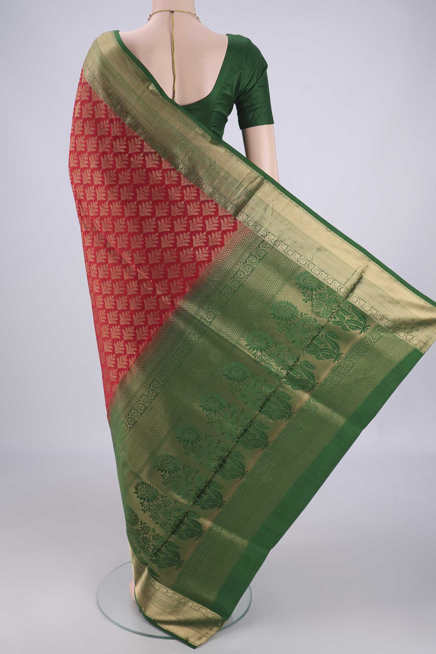 Flat view of Red Soft Silk Saree with Zari Brocade on the body and Zari Border. 
